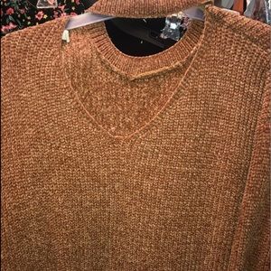 caramel sweater with cutout in the front.